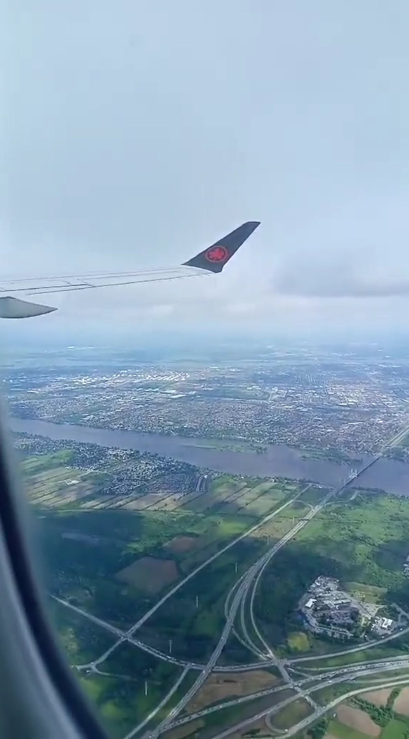 Aerial view of a river landscape from an aeroplane window
