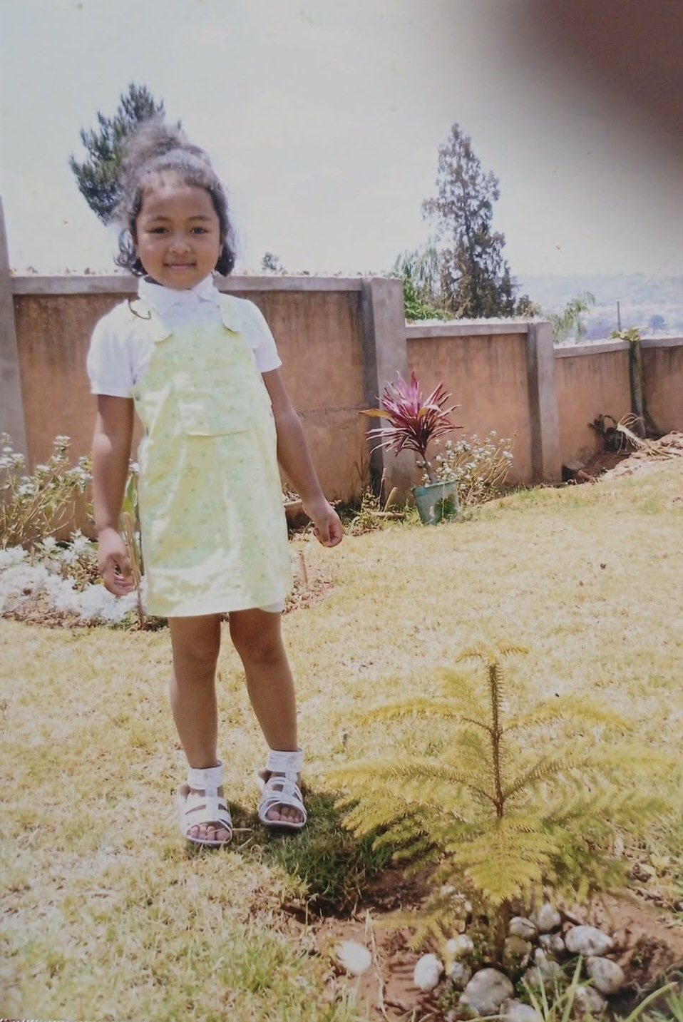 Miangaly as a child standing in the family garden in Antananarivo