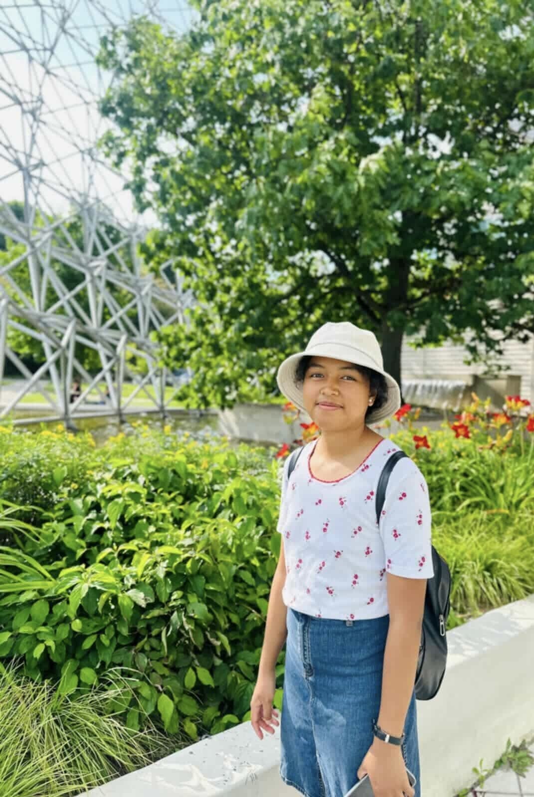 Miangaly walking through a botanical garden